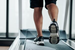 Fit man running on treadmill